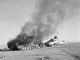 280 Tobruk St LMC Palmerston Nth Crusader Mk.1 passes a burning German Panzer