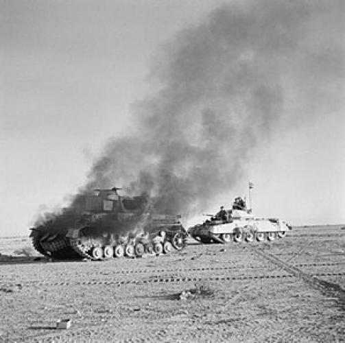 280 Tobruk St LMC Palmerston Nth Crusader Mk.1 passes a burning German Panzer
